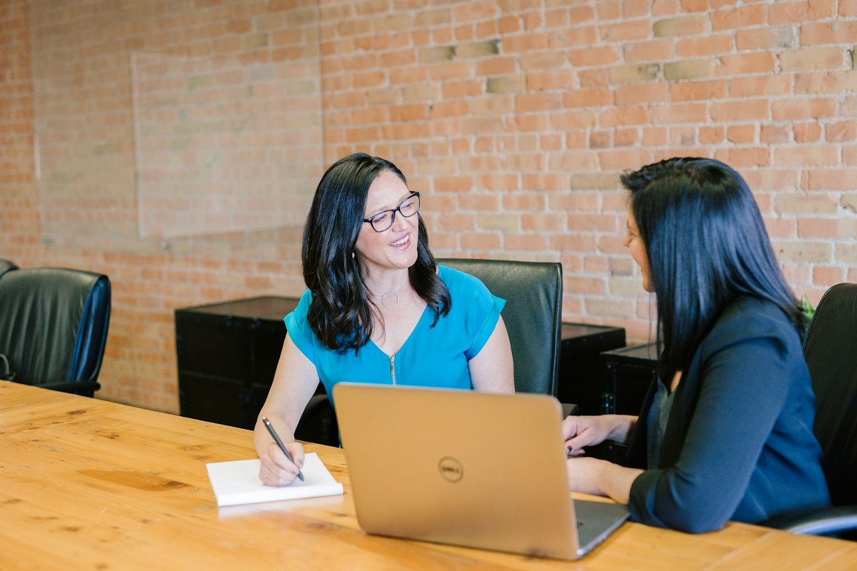 Corporate executives conducting investment negotiation meeting in modern conference room